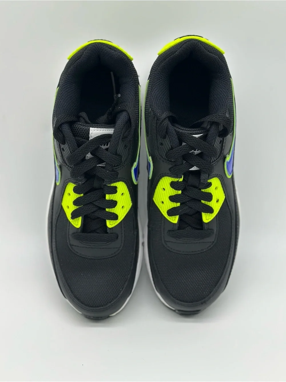 Nike Kids Black Sneakers with Neon Yellow and Blue Swoosh